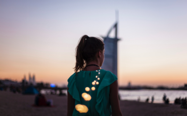 Girl in front of Burj Khalifa - Xploredubai